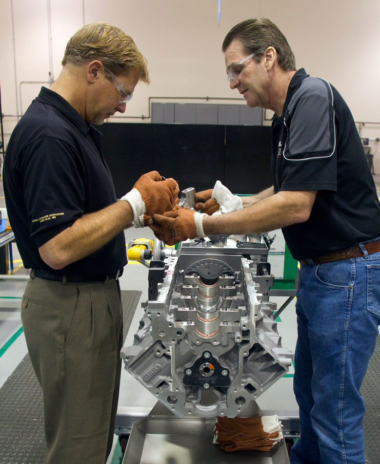 November 29, 2011: The 100 Millionth Small Block Chevy Engine is Built by Dave Cetnar of the UAW (left), with the guidance of GM Experimental Assembler John Ross, at the GM Performance Build Center in Wixom, Michigan