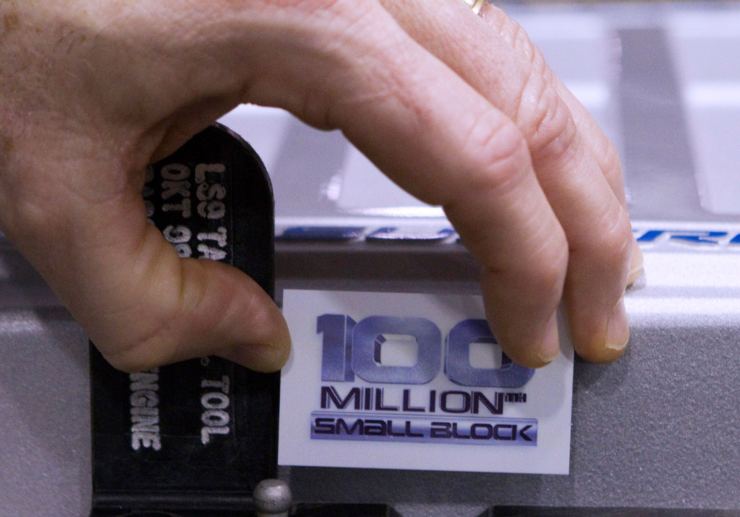 November 29, 2011: Dean Guard of General Motors puts a nameplate on the 100 Millionth Small Block Chevy Engine at the GM Performance Build Center in Wixom, Michigan