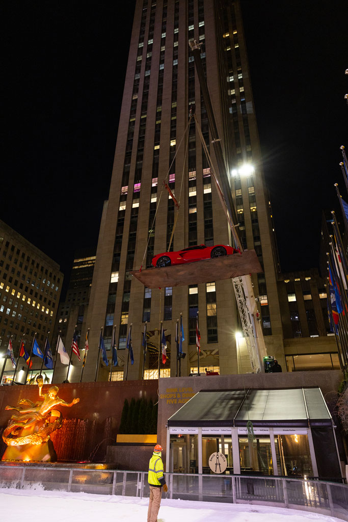 2024 Corvette E-Ray in Torch Red preparing to perform maneuvers on The Rink at Rockefeller Center in New York City