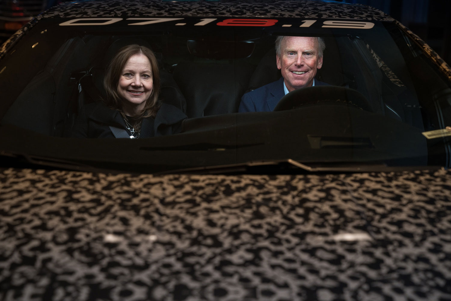 GM CEO Mary Barra accompanies Tadge Juechter in a teaser photo of the Corvette C8