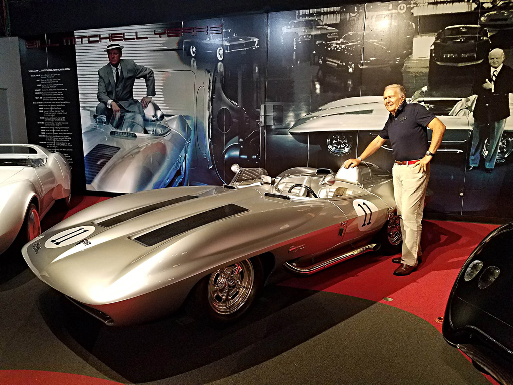 Peter Brock, who worked on the design of the 1959 Sting Ray Racer, poses with it at the National Corvette Museum in 2017
